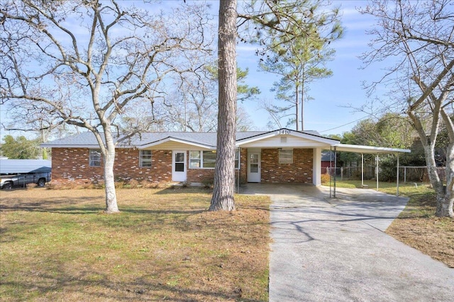 ranch-style house featuring a carport and a front lawn