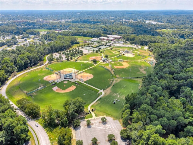 birds eye view of property with a forest view