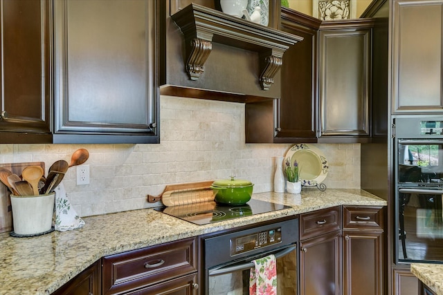 3005 Timber Woods Dr, Appling, GA 30802 - kitchen with range hood, stainless steel double oven, dark brown cabinets, black electric stovetop, and backsplash