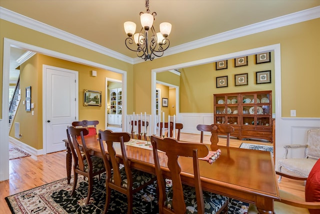 3005 Timber Woods Dr, Appling, GA 30802 - dining room with a chandelier, crown molding, light wood-style floors, and wainscoting