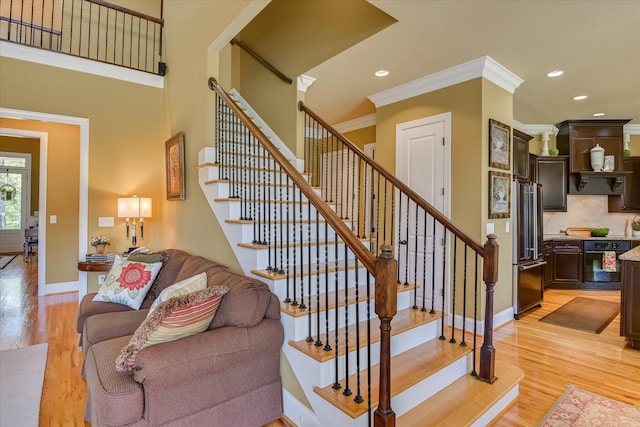 3005 Timber Woods Dr, Appling, GA 30802 - staircase with ornamental molding, wood finished floors, and recessed lighting
