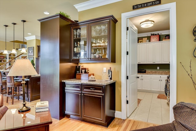 3005 Timber Woods Dr, Appling, GA 30802 - bar area featuring crown molding, pendant lighting, and light tile patterned floors