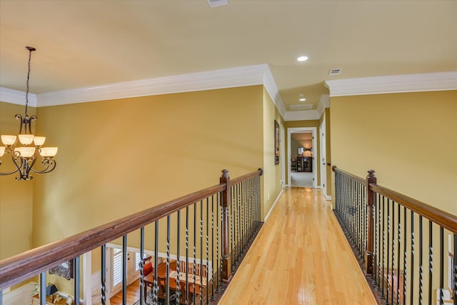 3005 Timber Woods Dr, Appling, GA 30802 - corridor with ornamental molding, a chandelier, light wood-style floors, an upstairs landing, and recessed lighting