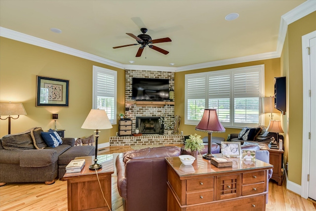 3005 Timber Woods Dr, Appling, GA 30802 - living area featuring a ceiling fan, healthy amount of natural light, light wood finished floors, crown molding, and a brick fireplace