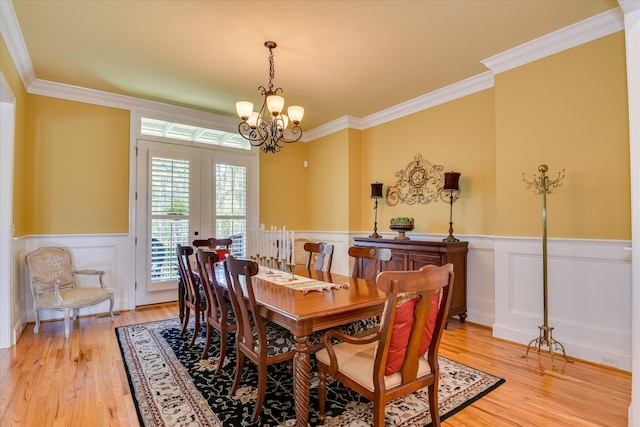 3005 Timber Woods Dr, Appling, GA 30802 - dining room with a wainscoted wall, light wood-style floors, ornamental molding, a chandelier, and a decorative wall