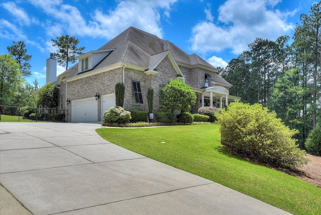 3005 Timber Woods Dr, Appling, GA 30802 - view of side of property featuring concrete driveway, brick siding, a garage, and a chimney