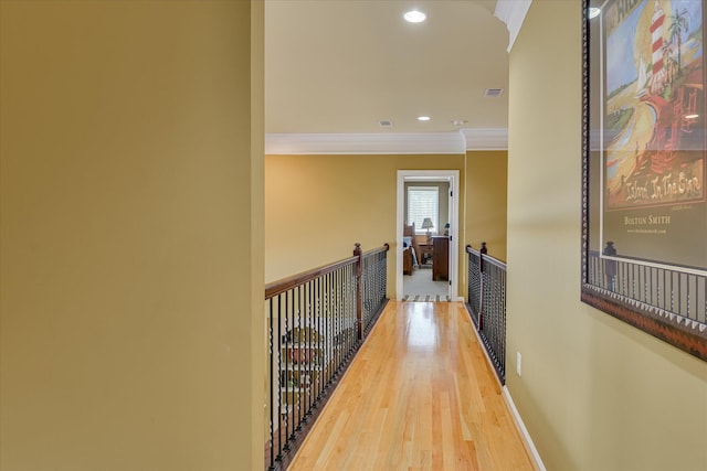 3005 Timber Woods Dr, Appling, GA 30802 - hall with crown molding, wood finished floors, recessed lighting, and an upstairs landing