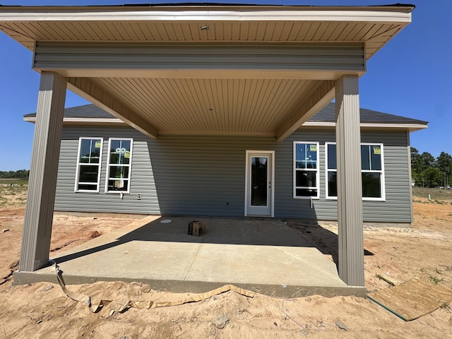 entrance to property with a patio