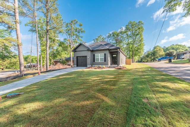 1717 Plank Rd, North Augusta, SC 29841 - view of front facade featuring a front yard, an attached garage, and concrete driveway