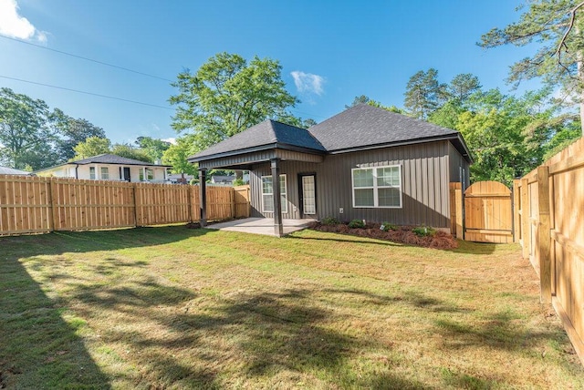 1717 Plank Rd, North Augusta, SC 29841 - back of house with a lawn, a fenced backyard, a patio, a gate, and roof with shingles