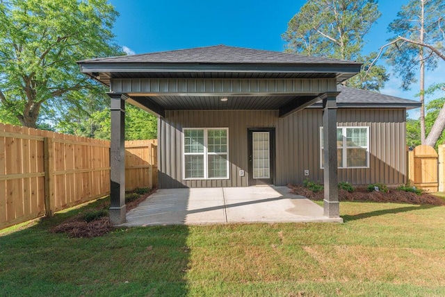 1717 Plank Rd, North Augusta, SC 29841 - rear view of property featuring roof with shingles, board and batten siding, a patio area, a yard, and fence