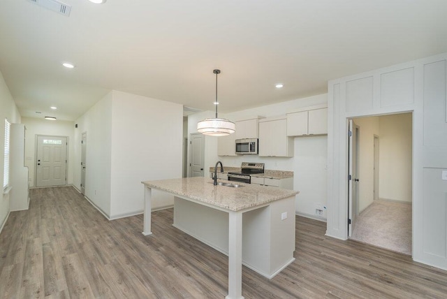 1717 Plank Rd, North Augusta, SC 29841 - kitchen with an island with sink, visible vents, a sink, stainless steel appliances, and light wood finished floors
