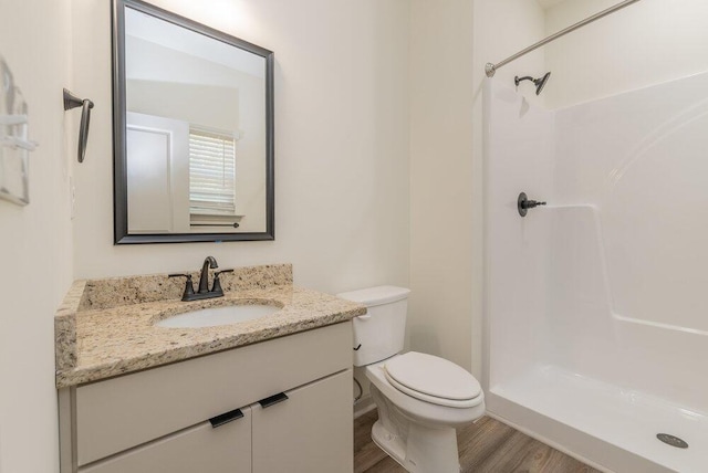 1717 Plank Rd, North Augusta, SC 29841 - bathroom with a shower stall, wood finished floors, vanity, and toilet