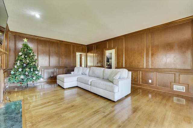 living room with light hardwood / wood-style flooring