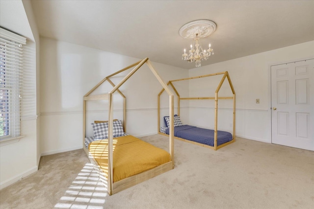 carpeted bedroom with a notable chandelier