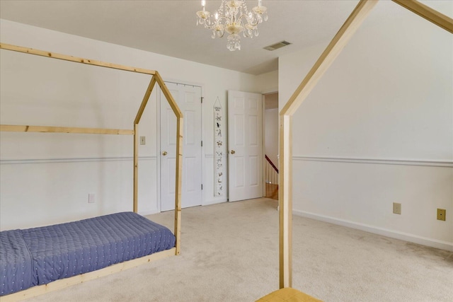 unfurnished bedroom with an inviting chandelier and light colored carpet