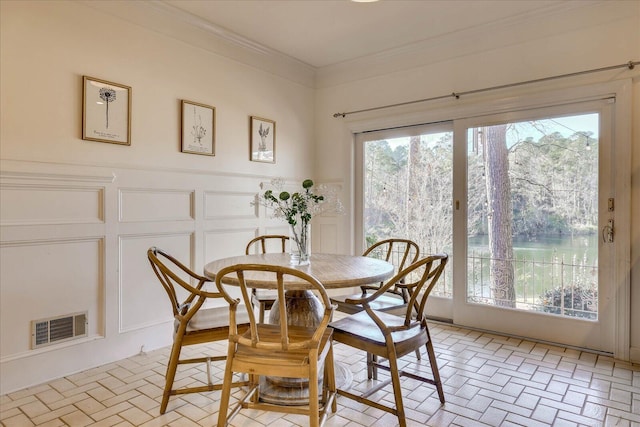 dining room with crown molding