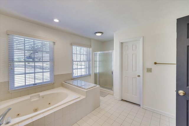 bathroom with separate shower and tub and tile patterned floors