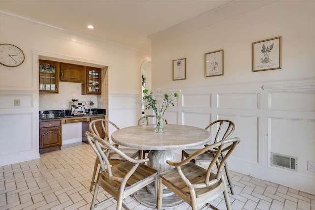 dining room with crown molding