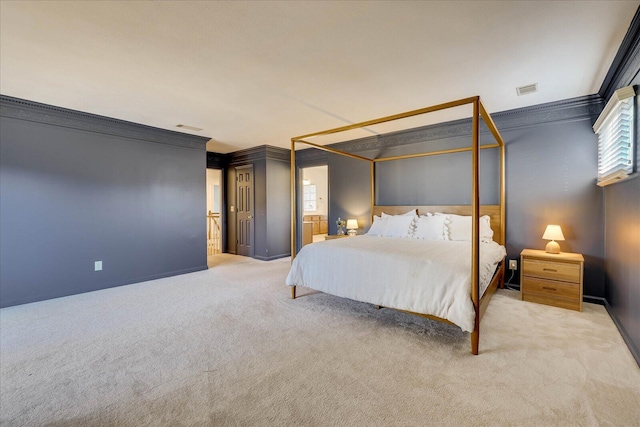 carpeted bedroom featuring ornamental molding