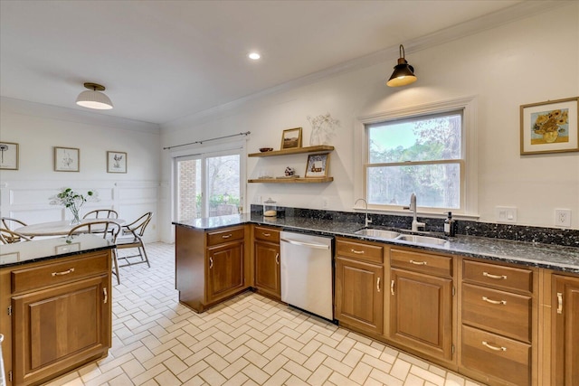 kitchen featuring ornamental molding, sink, dishwasher, and dark stone countertops