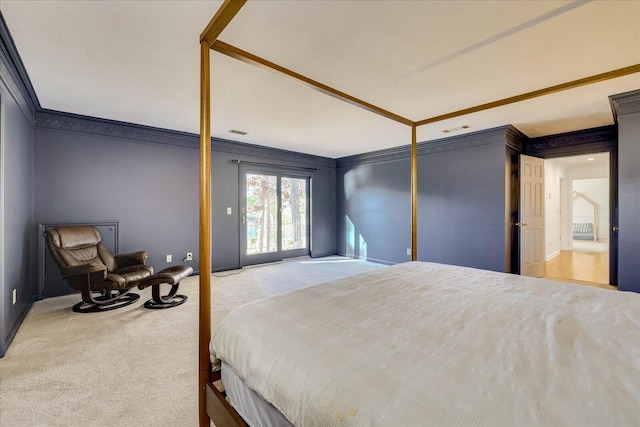 carpeted bedroom featuring access to exterior and ornamental molding