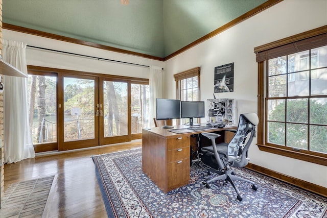 office area featuring a high ceiling, french doors, and dark hardwood / wood-style floors