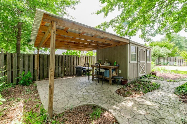 3039 Tarleton Ct, Beech Island, SC 29842 - fenced backyard featuring a patio area and an outbuilding