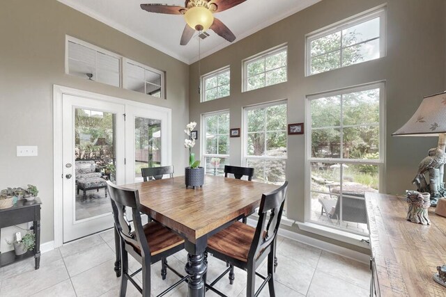3039 Tarleton Ct, Beech Island, SC 29842 - dining space featuring ceiling fan, light tile patterned floors, crown molding, french doors, and a high ceiling