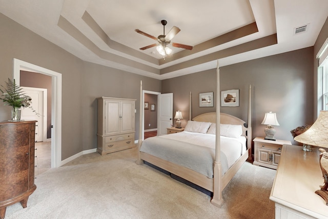 3039 Tarleton Ct, Beech Island, SC 29842 - bedroom featuring a tray ceiling, light colored carpet, and ceiling fan