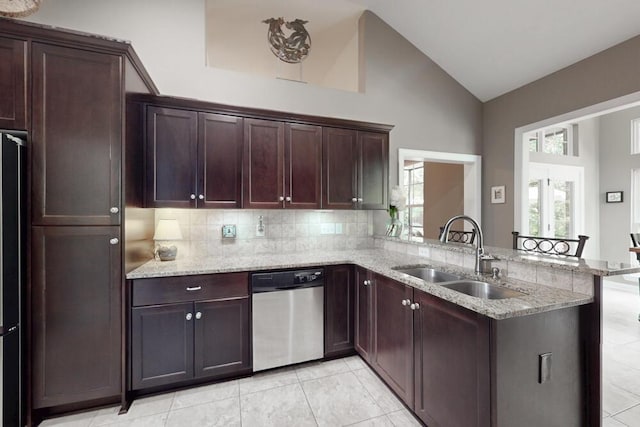 3039 Tarleton Ct, Beech Island, SC 29842 - kitchen with stainless steel dishwasher, a peninsula, decorative backsplash, light stone counters, and high vaulted ceiling