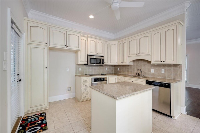 1034 N Pointe Ct, Tignall, GA 30668 - kitchen featuring stainless steel appliances, cream cabinets, ceiling fan, crown molding, and light stone countertops