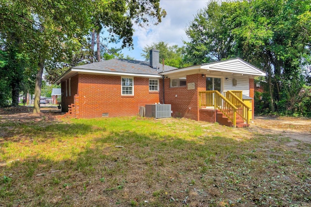 2148 Reedale Ave, Augusta, GA 30906 - back of property featuring crawl space, a chimney, a lawn, central AC, and brick siding