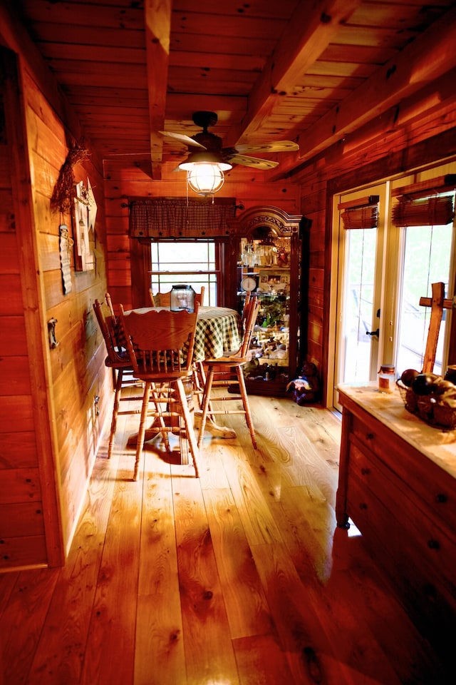 545 Beech Island Ave, Beech Island, SC 29842 - dining room featuring wood walls, hardwood / wood-style floors, a wood ceiling with exposed beams, and ceiling fan