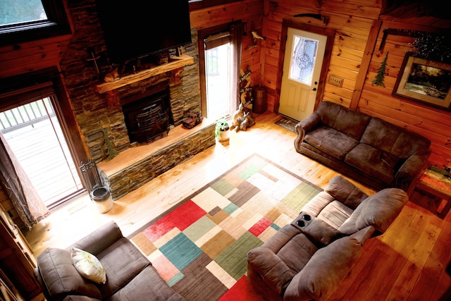 545 Beech Island Ave, Beech Island, SC 29842 - living area featuring hardwood / wood-style floors, a fireplace, and wooden walls