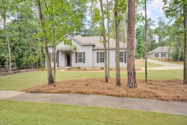 1962 Bunting Dr, North Augusta, SC 29841 - modern farmhouse style home featuring roof with shingles and a front yard