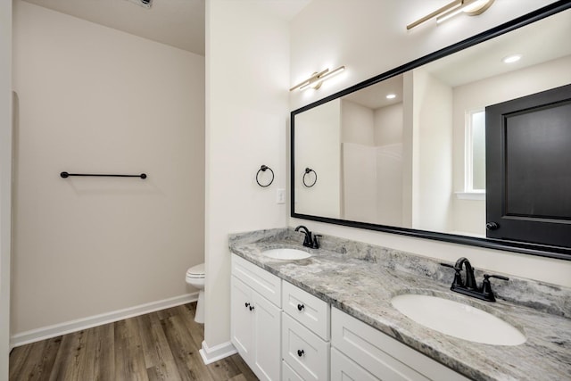 1962 Bunting Dr, North Augusta, SC 29841 - bathroom with wood finished floors, double vanity, and recessed lighting
