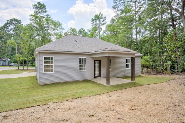 1962 Bunting Dr, North Augusta, SC 29841 - rear view of house featuring a patio area, a lawn, and roof with shingles