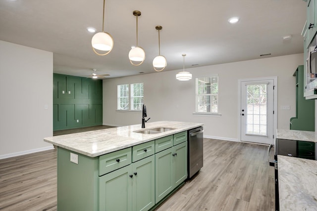 1962 Bunting Dr, North Augusta, SC 29841 - kitchen with green cabinets, stainless steel appliances, light wood-type flooring, an island with sink, and decorative light fixtures