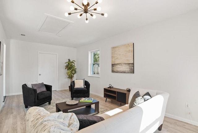 3609 Cameron Dr, Augusta, GA 30906 - living area featuring light wood finished floors, a chandelier, visible vents, and baseboards