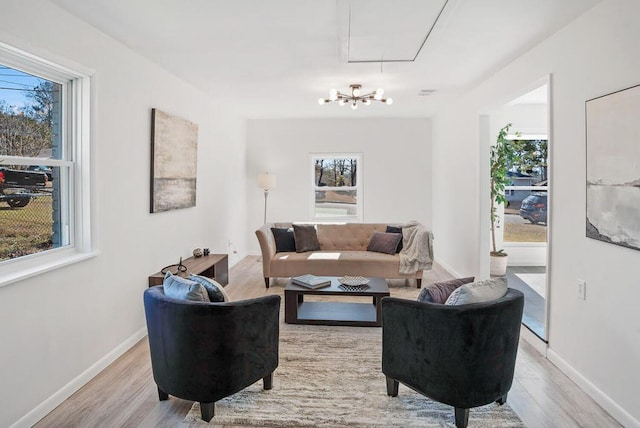 3609 Cameron Dr, Augusta, GA 30906 - living area featuring attic access, baseboards, an inviting chandelier, and wood finished floors