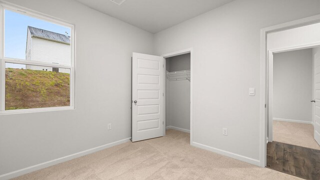 2912 Saltwater Bnd, Beech Island, SC 29842 - unfurnished bedroom with light carpet and a closet