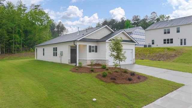 view of front of property featuring a garage and a front yard