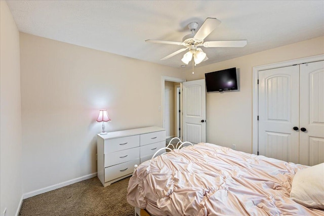 carpeted bedroom featuring a closet and ceiling fan