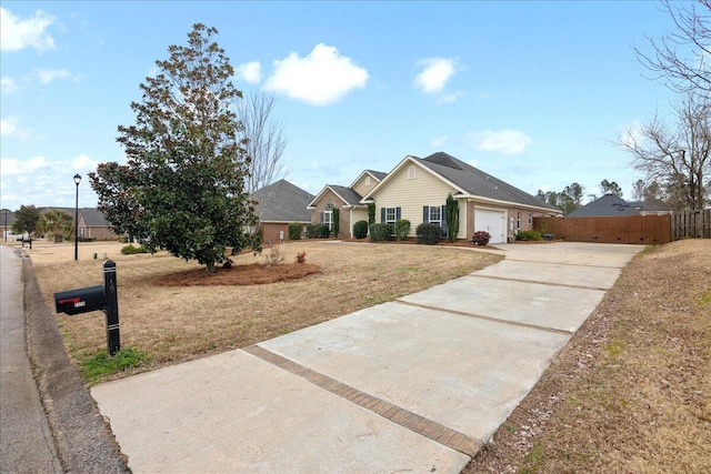 ranch-style house with a garage and a front yard