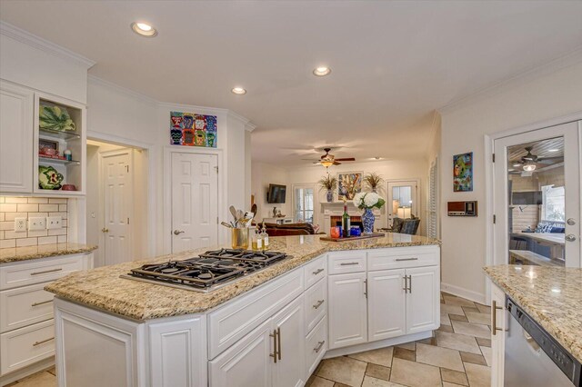 kitchen with a ceiling fan, appliances with stainless steel finishes, ornamental molding, backsplash, and recessed lighting