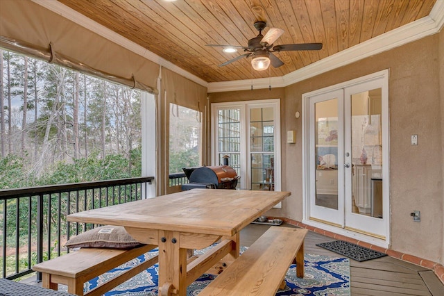 sunroom / solarium with french doors, wood ceiling, and a ceiling fan