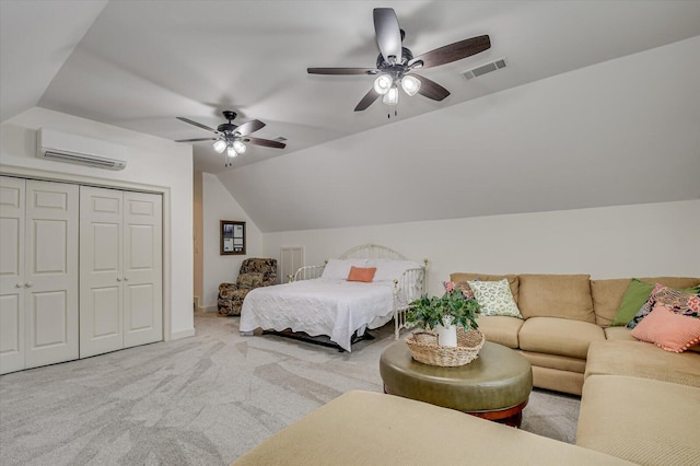 bedroom featuring carpet floors, lofted ceiling, a closet, visible vents, and a wall mounted AC