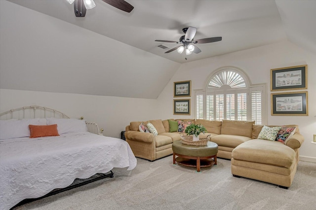 bedroom with light carpet, visible vents, a ceiling fan, and lofted ceiling