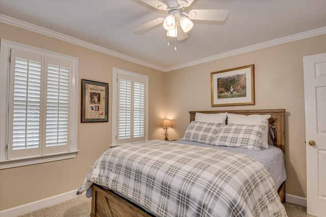 bedroom with carpet floors, crown molding, baseboards, and ceiling fan